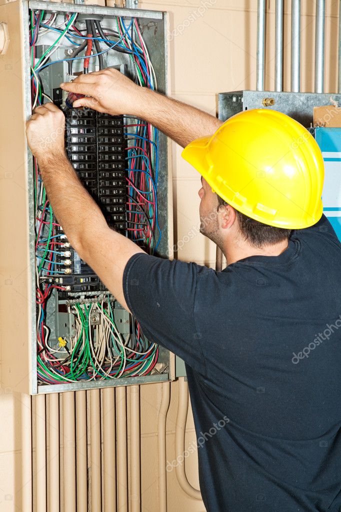 depositphotos_6516758-stock-photo-electrician-working-on-electrical-panel.jpg